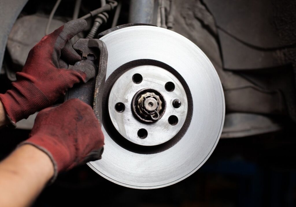 Customer reviewing flat-rate RV repair quote on a tablet with technician