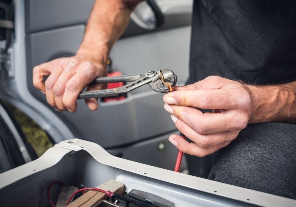 Close-up of technician showing a customer a service quote on a tablet before starting repair