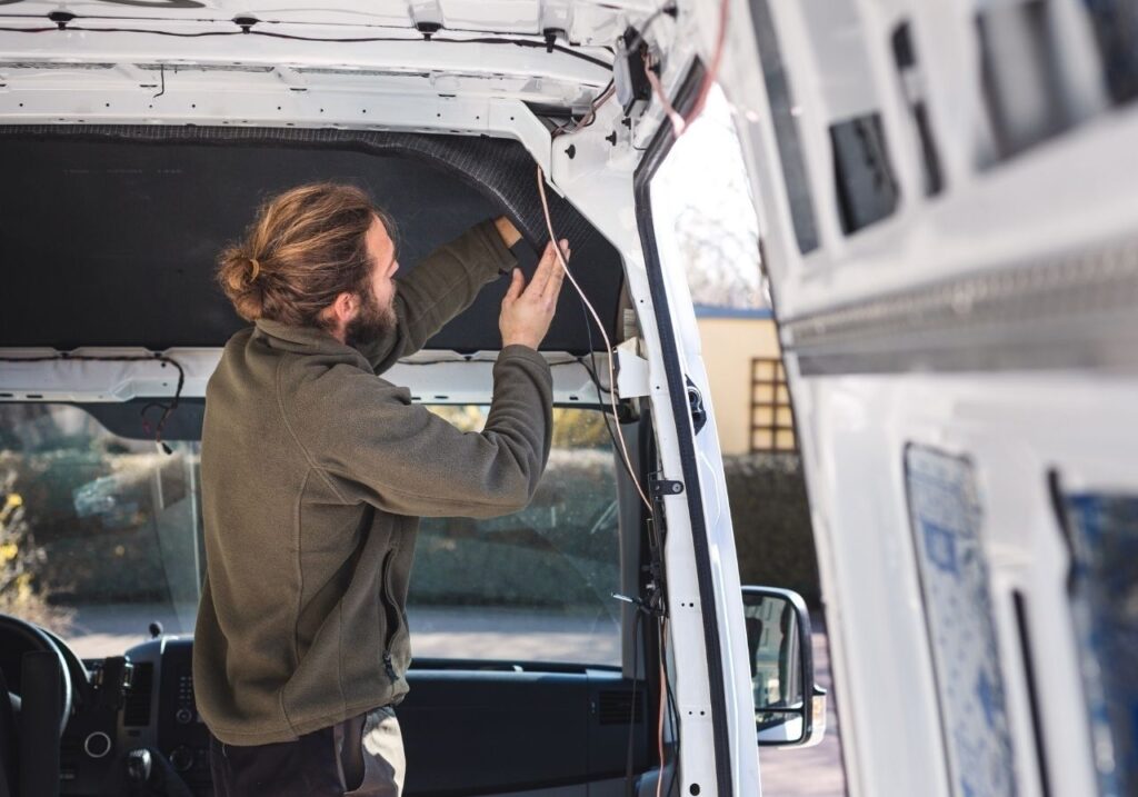 RV service van parked in a Birmingham neighborhood with a certified tech unloading gear