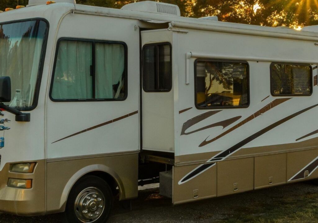 Certified technician fixing a slide-out motor on an RV parked at Hoover Met Complex RV Park