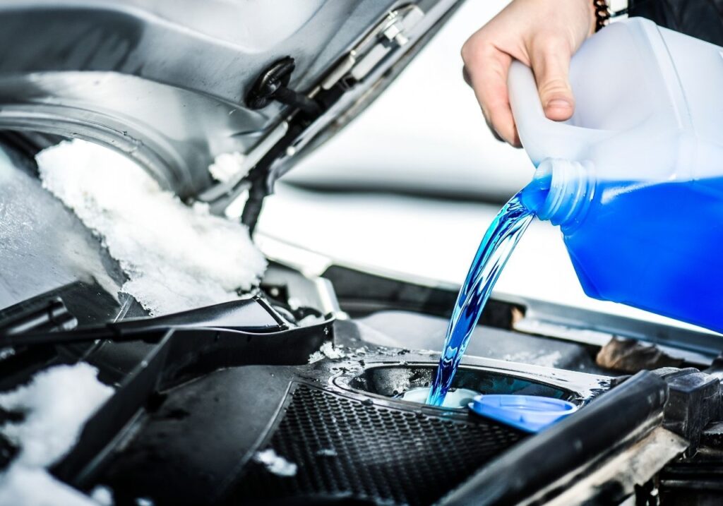 Certified technician checking RV tires and seals as part of seasonal prep
